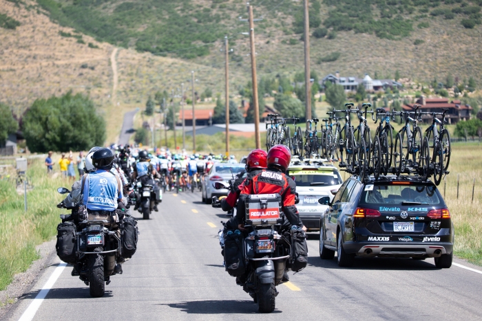 Photo Motos line up at the back of the peloton patiently waiting for the right timing to pass.