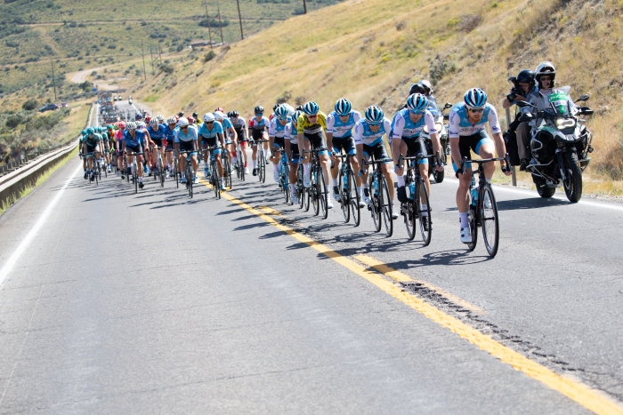 Israel Cycling Academy controls the front of the peloton.