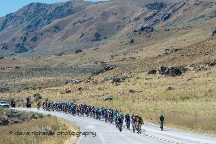 Rugged peaks overlook the riders as they traverse Antelope Island. Stage 3 - Antelope Island State Park to North Salt Lake City, 2019 LHM Tour of Utah (Photo by Dave Richards, daverphoto.com)