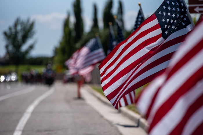 Flags lining Eagle Ridge Drive wave in the breeze. Stage 3, 2019 Tour of Utah. Photo by Steven L. Sheffield