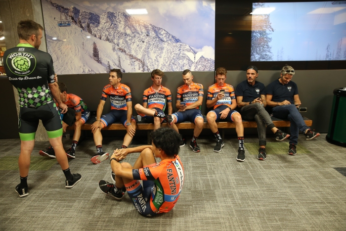 Riders of NIPPO-Vini Fantini-Faizane and Jonathon Clarke of Worthy Pro Cycling chill before Team Presentation.