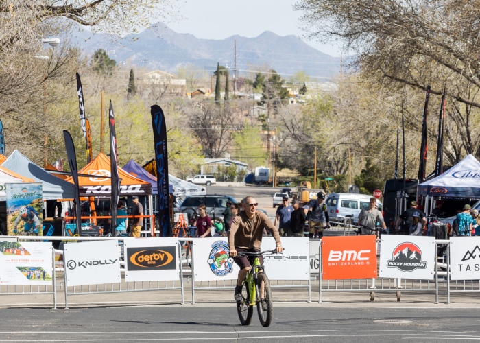 A mountain biker with the Hurricane MTB Festival venue in the background. Photo by John Shafer, Photo-John.net