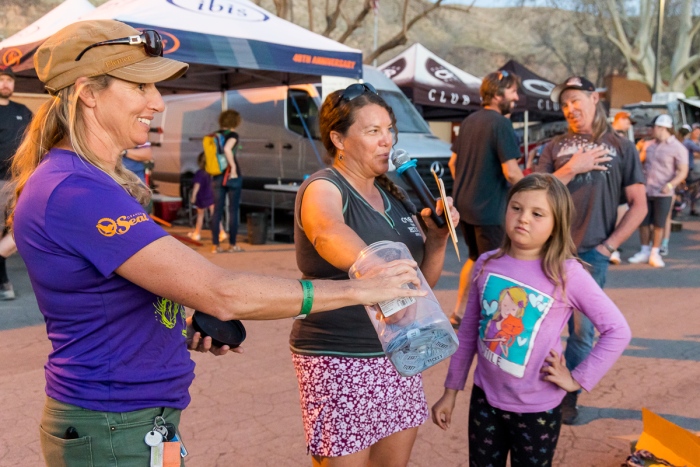 Festival organizer, Dejay Morisette, picking giveaway tickets during the 2022 Hurricane MTB Festival. Photo by John Shafer, Photo-John.net