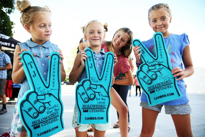 Happy young fans with an autograph and message: Thanks for the love from TJ Eisenhart. 2018 Tour of Utah Team Presentation, August 4, 2018, Cedar City, Utah. Photo by Cathy Fegan-Kim, cottonsoxphotography.net