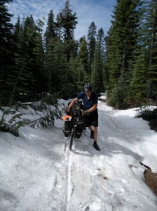 Trudging through snow high on Henness Pass Road.