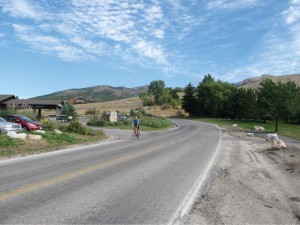 Catching his breath, a rider descends Powder Mountain Road past Wolf Creek Resort.