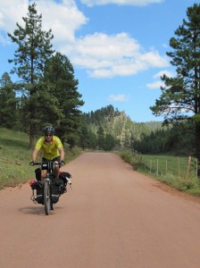 Riding NM-126 red dirt in the Jemez Mountains before the descent into Cuba, NM.