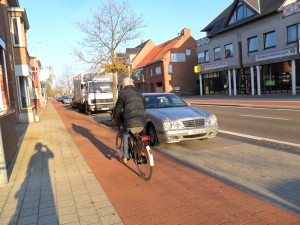 A older rider on a cycletrack in Belgium.