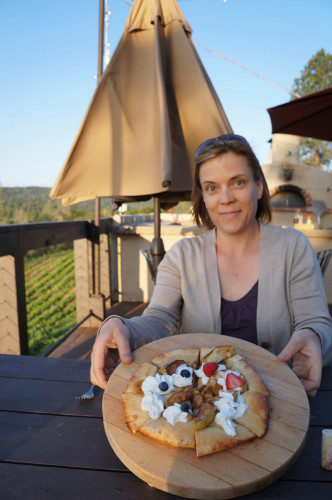 Lynda showing off a wood-fired dessert pizza at the Fitzpatrick Winery.