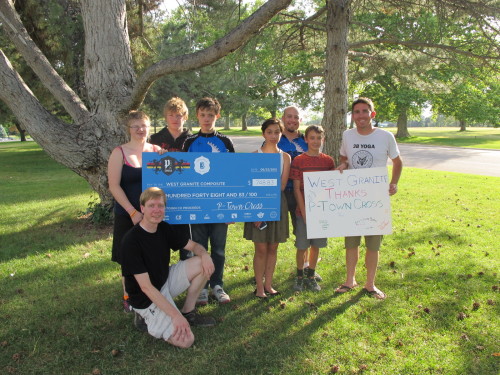 Joe Johnson, right, of the P-Town Cross series, presents the West Granite Composite High School Mountain Biking Team a $748 donation. Photo courtesy Joe Johnson