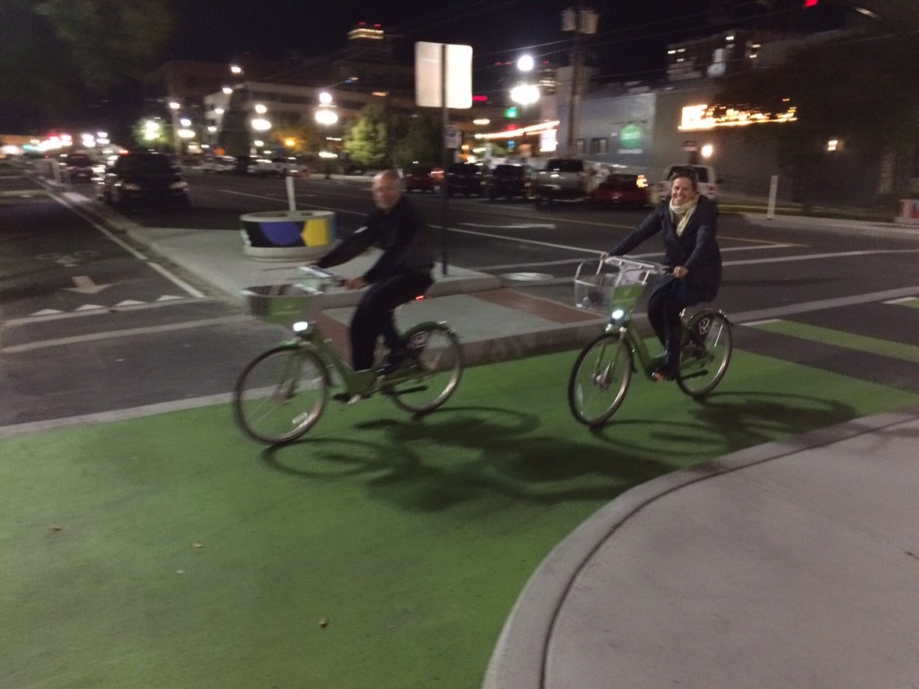 Gary Sjoquist and Ashley Korenblatt ride GreenBikes in downtown Salt Lake City. Photo by Dave Iltis