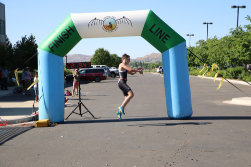 Julian Pellmann celebrates his win in the Men's Olympic open category at the 2016 DinoTri in Vernal, Utah. Photo by Dave Iltis