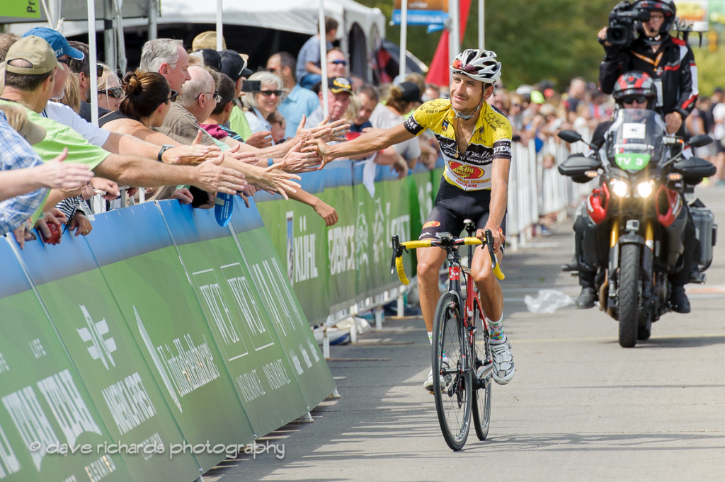 Yellow jersey leader Lachlan Morton (Jelly Belly Maxxis) high fives the fans along the finish of Stage 5, 2016 Tour of Utah. Photo by Dave Richards, daverphoto.com