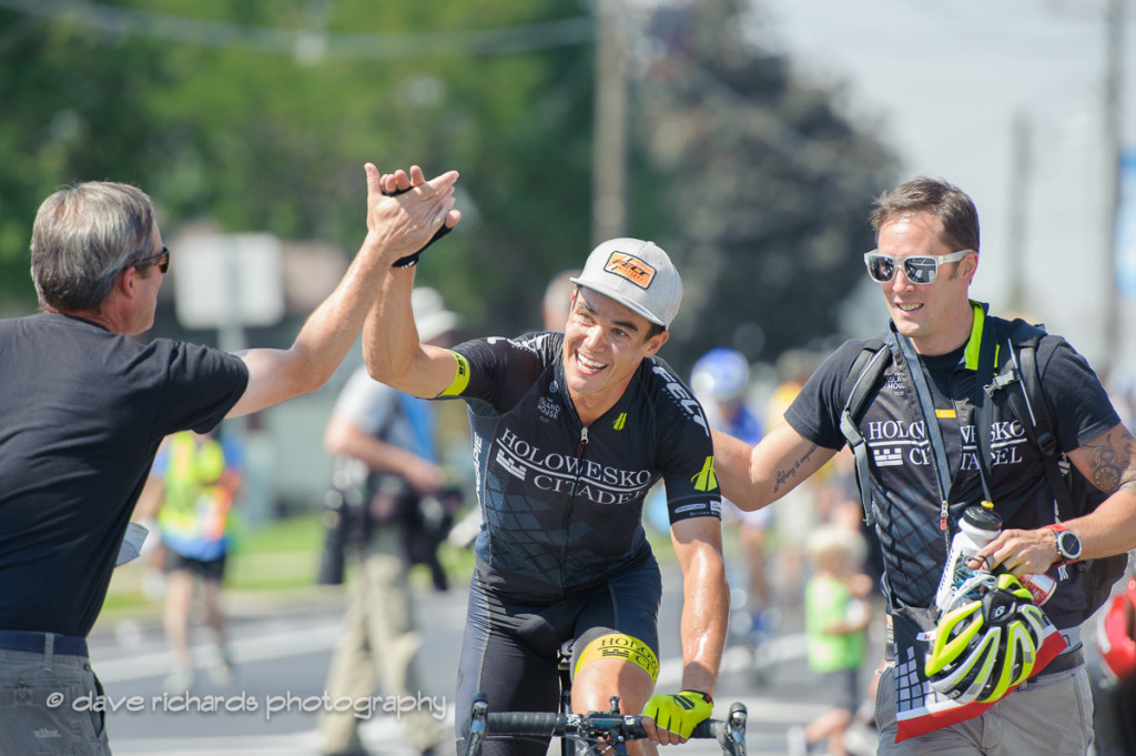 Travis McCabe (Holowesko/Citadel Hincapie) is congratulated by his team for the win on Stage 4, 2016 Tour of Utah. Photo by Dave Richards, daverphoto.com