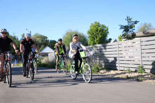 Salt Lake City Mayor Jackie Biskupski and police chief Mike Brown ride on the McClelland Trail during May's Bike to Work Day. Salt Lake City has made improvements, but has a long way to go to catch up to the top biking cities in the West. Photo by Dave Iltis