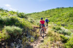 Erica trails her son on a downhill. Photo by DIscover Utah/Monique Beeley