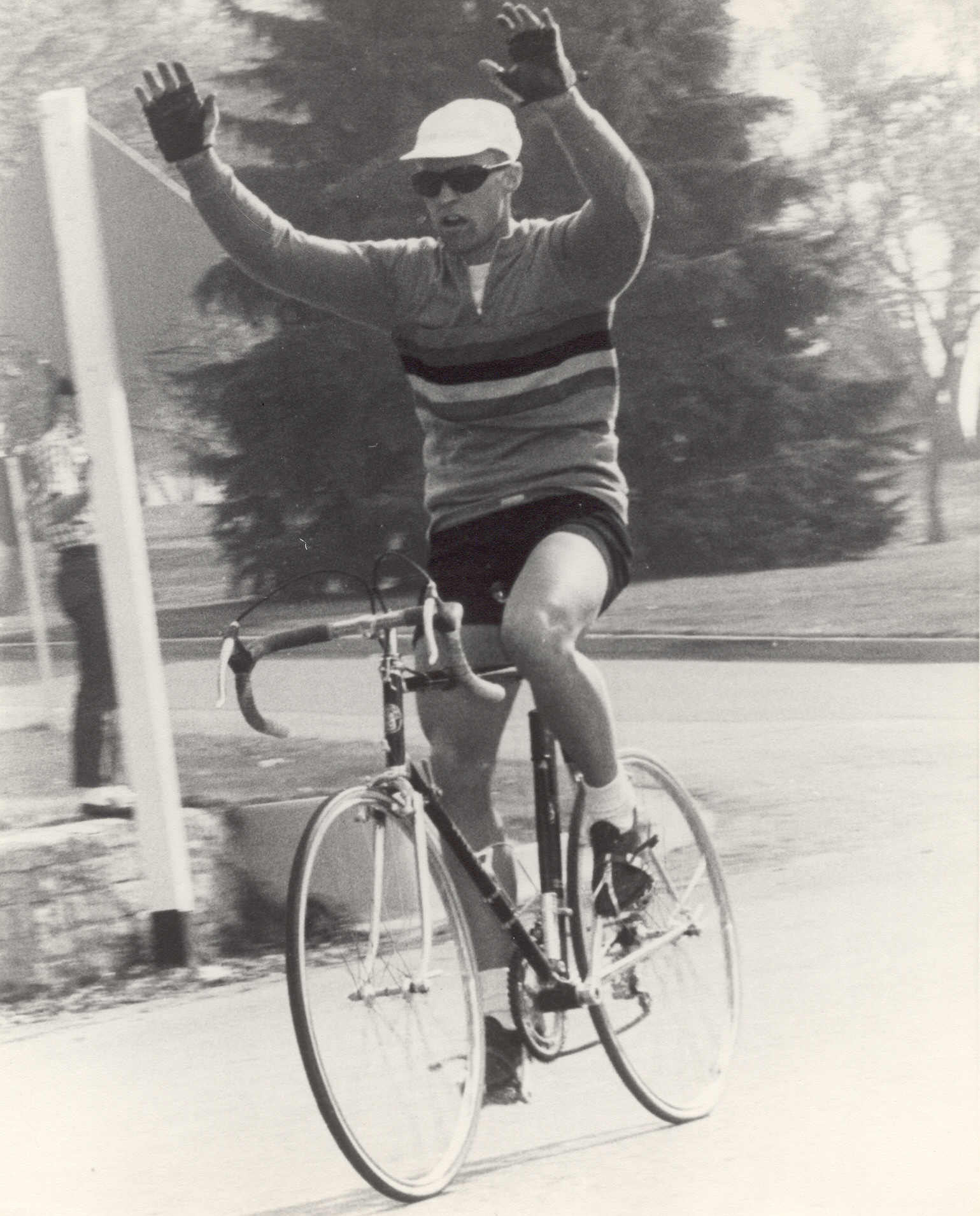 Jan Hyde raises his arms in victory in the BYU to UofU campus race aboard his now-classic Cinelli racing bike.