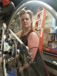 Mollie Bourdos is a mechanic at the Bicycle Collective. Photo by Philip Bourdos