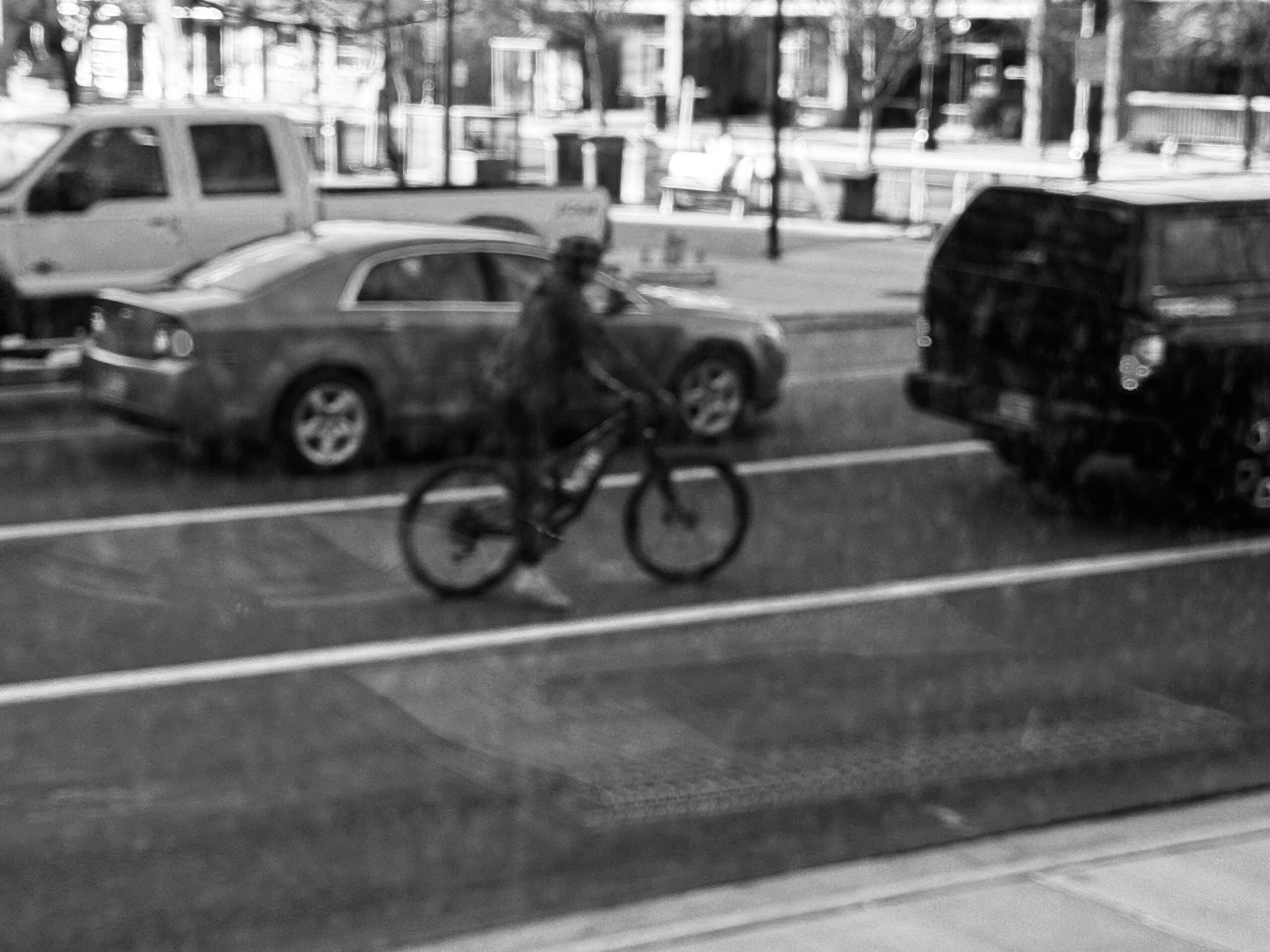 A cyclist waiting for the light. Photo by Dave Iltis