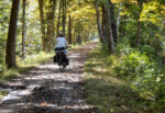 Roz Newmark riding on the C & O Canal Towpath. Photo by John Roberson