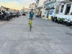 Lisa Hazel riding through town in Spetses. Photo by Dave Iltis